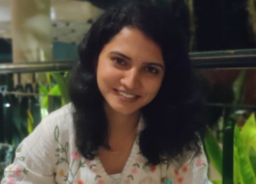 Supriya smiling in front of camera